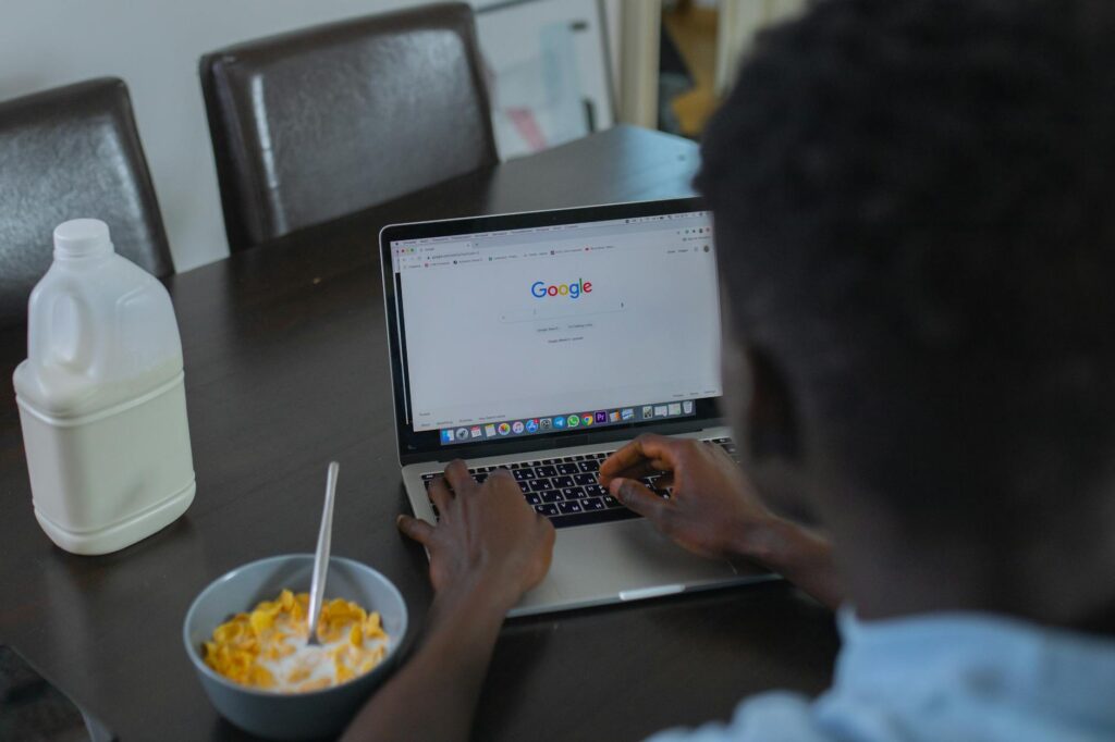 a person using google website on a laptop