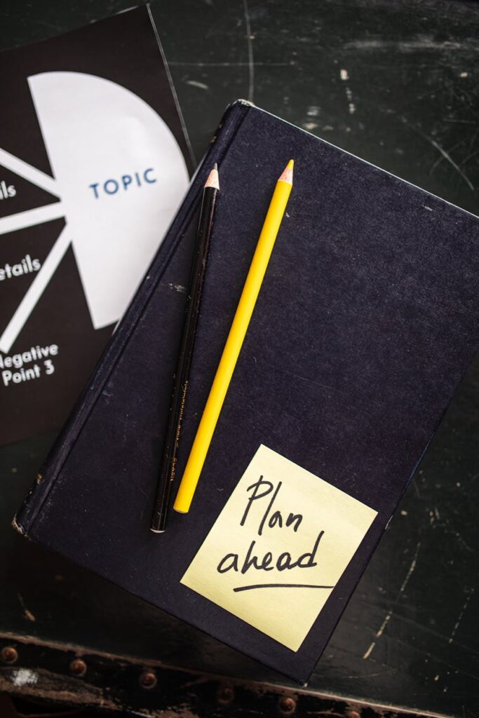 colored pencils on top of a diary